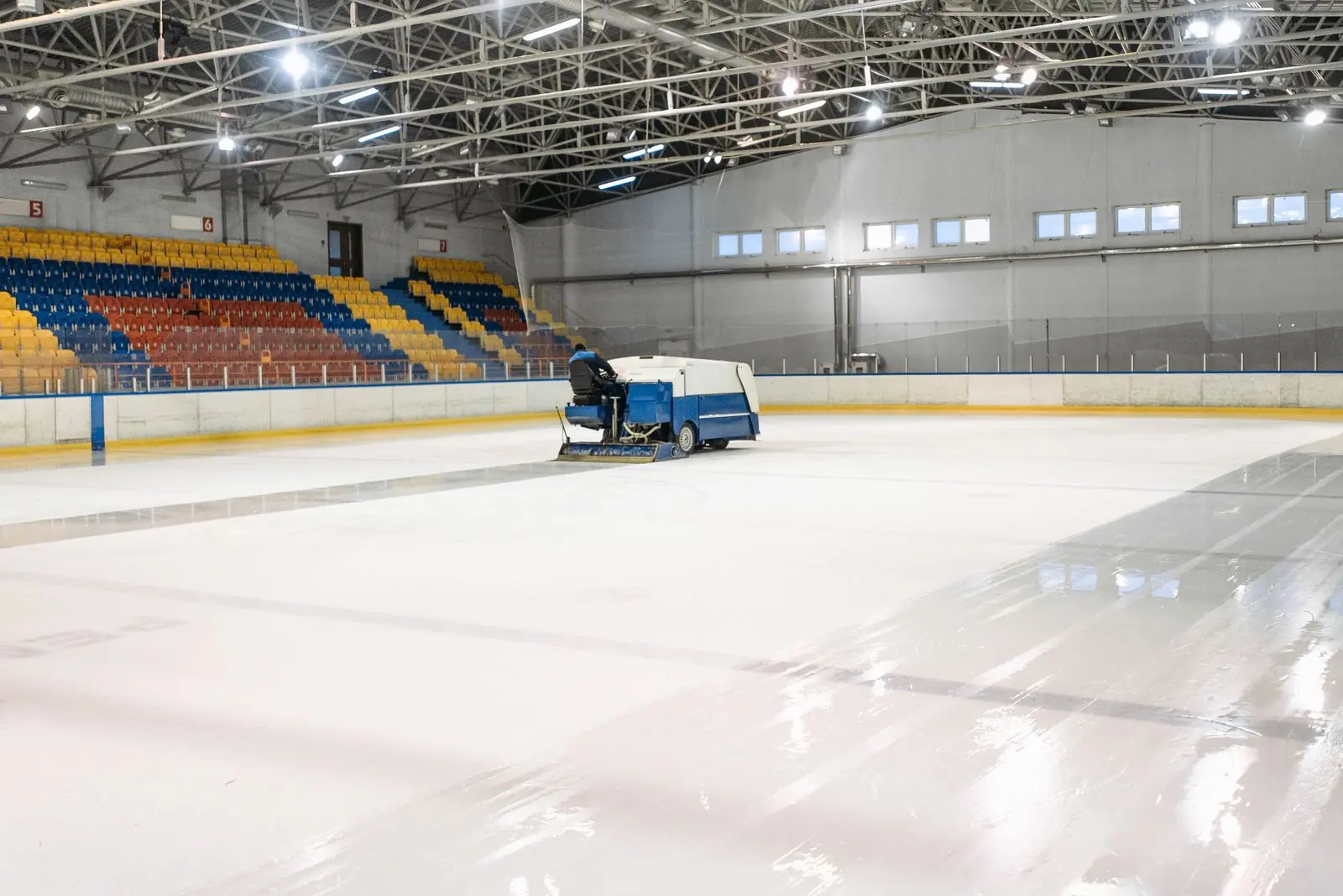 An indoor arena being resurfaced before an event
