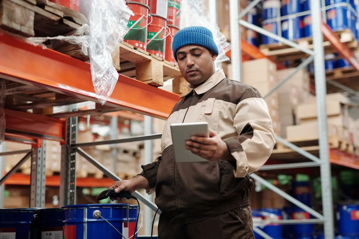 A worker checking a task list on a tablet